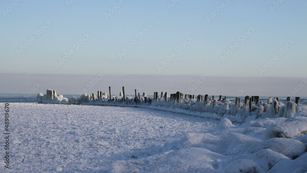 Stone breakwater at the sea. Stone breakwater at the sea.