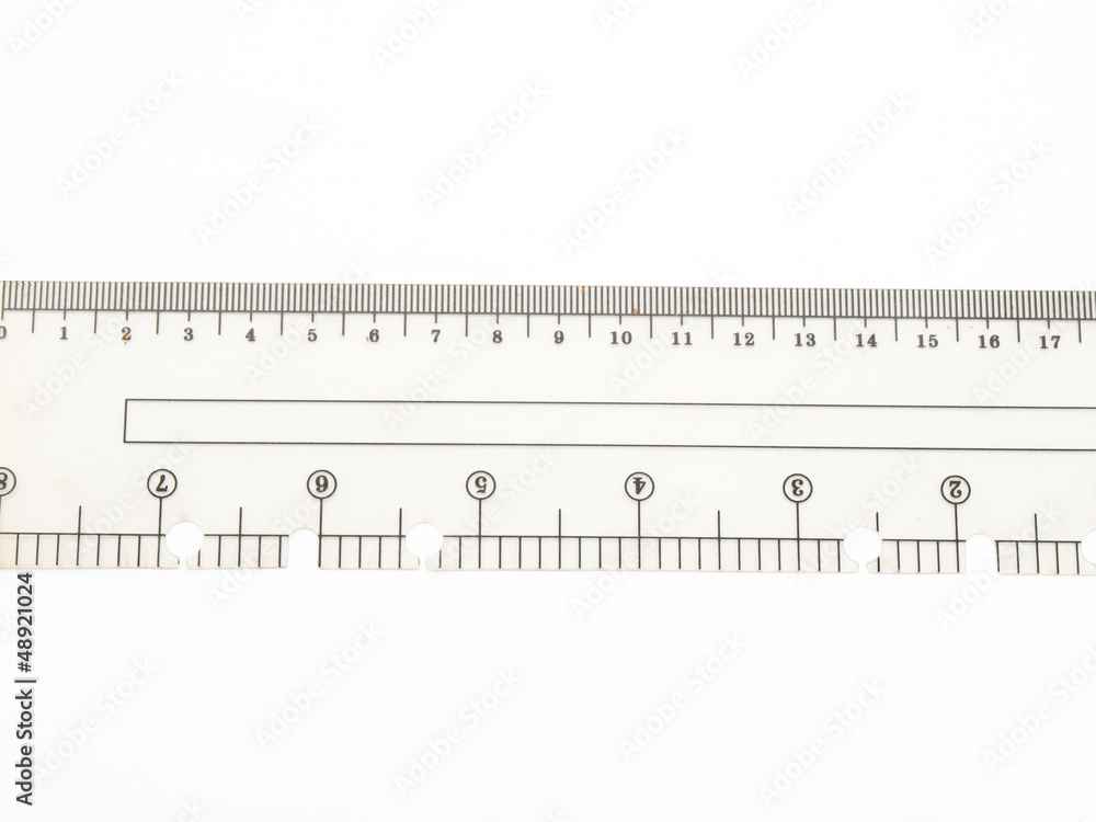 Closeup of used plastic ruler isolated on white background Closeup of used plastic ruler isolated on white background