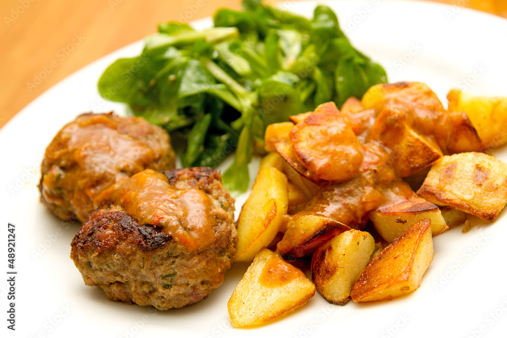 Frikadellen mit Bratkartoffeln und Feldsalat Stock Photo | Adobe Stock