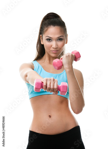 Sportive woman works out with pink dumbbells, isolated on white