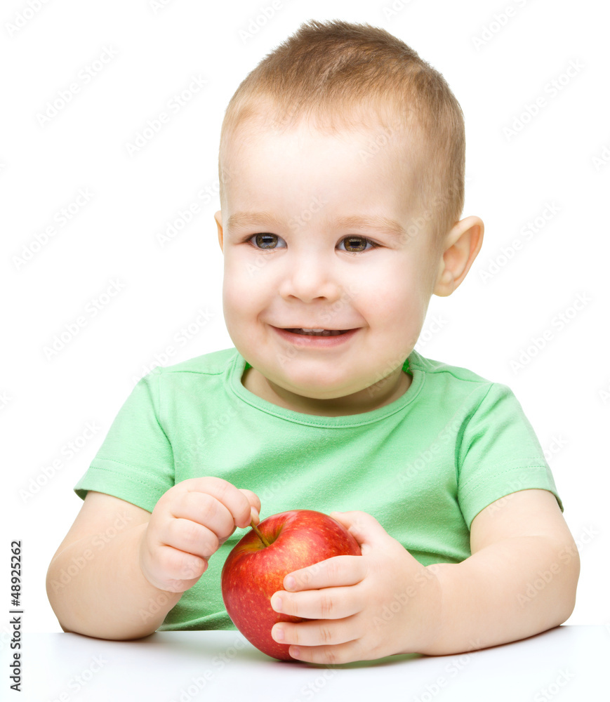 Portrait of a cute little boy with yellow apples Portrait of a cute little boy with yellow apples