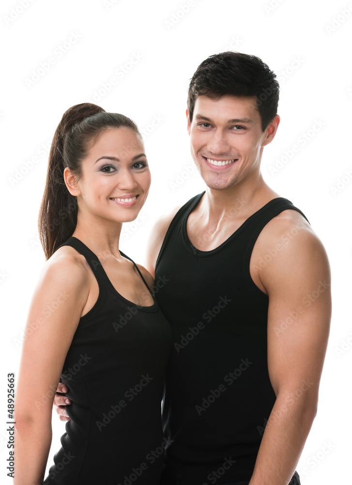 Two sportive people in black sportswear embrace each other Two sportive people in black sportswear embrace each other