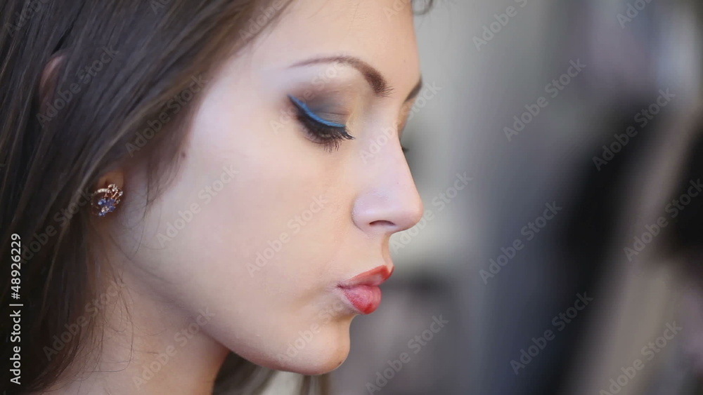 Model making-up for photo session in studio. Model making-up for photo session in studio.