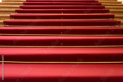 Red carpet on wooden steps