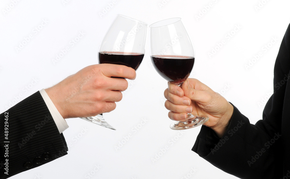 Business man and woman touch wine glasses Business man and woman touch wine glasses