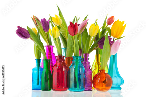 фотографія Colorful tulips in glass vases