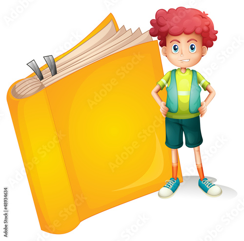 A young curly boy and a big book