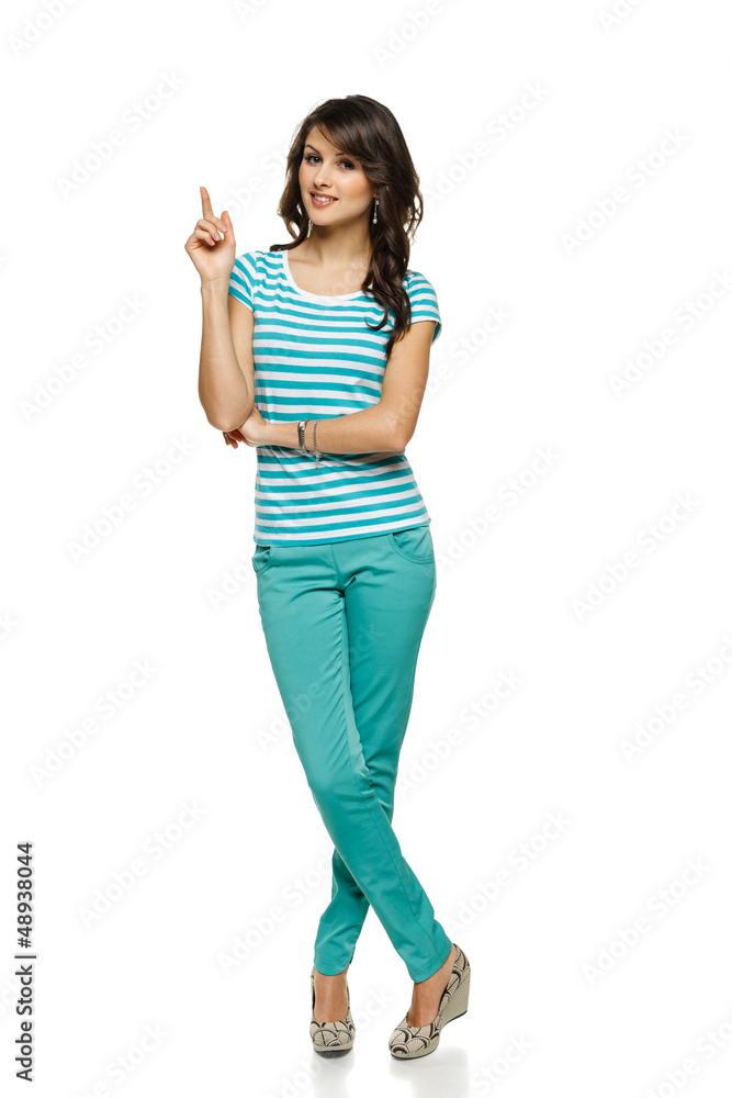 Full length of beautiful blond woman pointing up Full length of beautiful blond woman pointing up