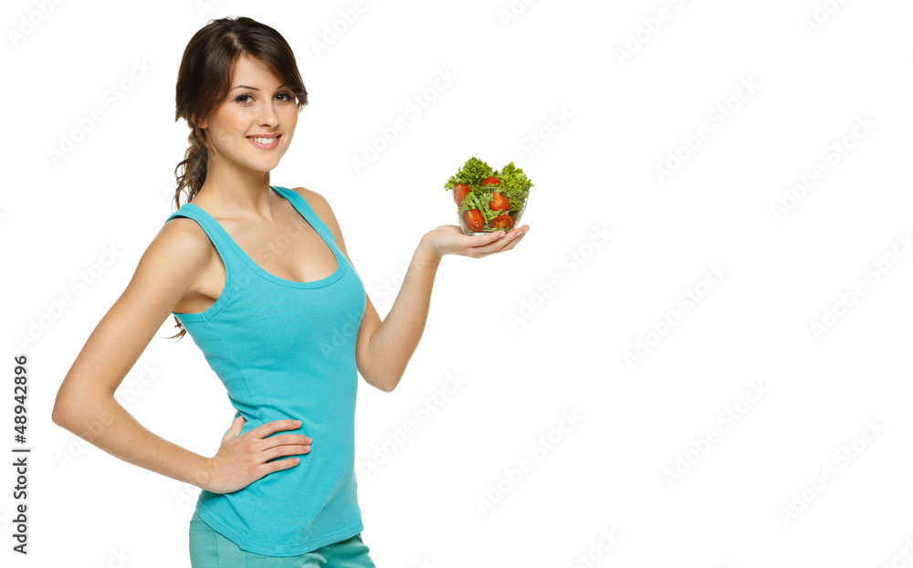 Beautiful woman holding transparent bowl with salad Beautiful woman holding transparent bowl with salad