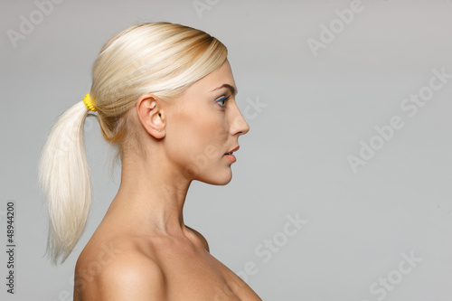 Side view closeup of beautiful blond woman looking forward