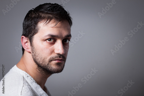 Young handsome man with serious expression