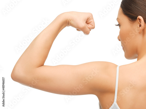 sporty woman flexing her biceps