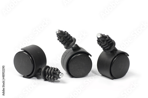 Plastic wheels for furniture, made of black plastic, isolated photo