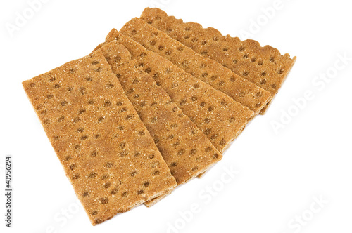 Several crispbread pieces isolated on white photo