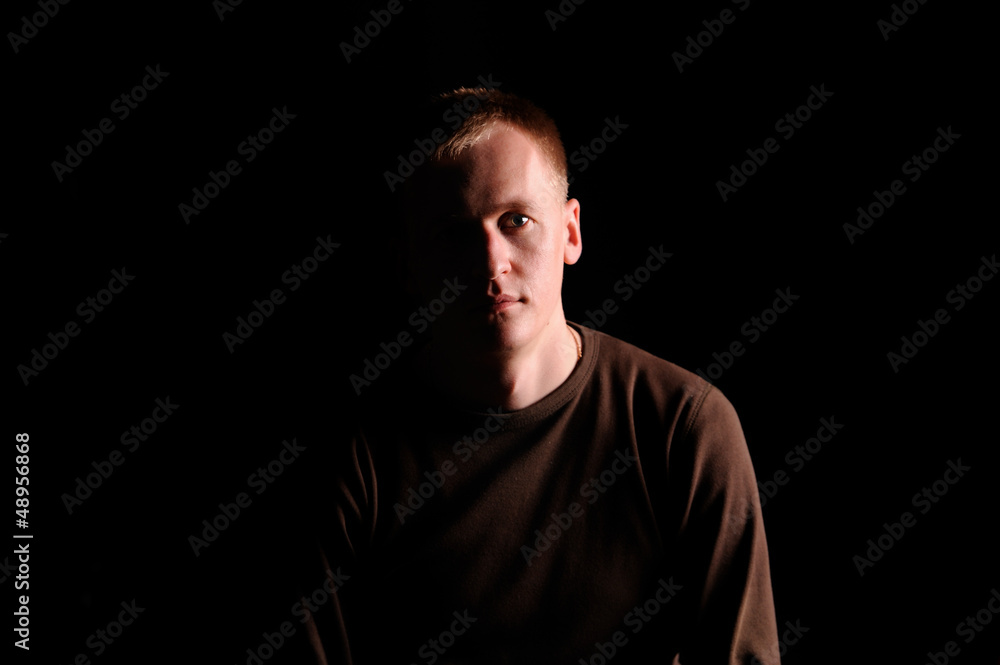 portrait of the man on black background