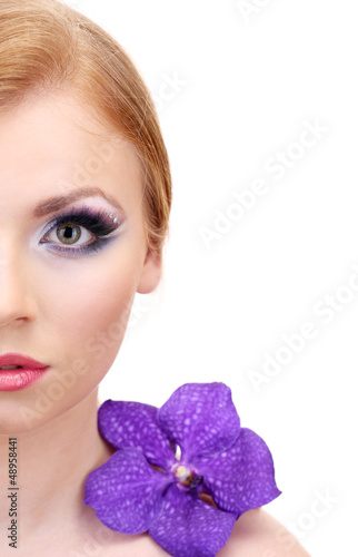 Portrait of beautiful young woman with glamour make up and