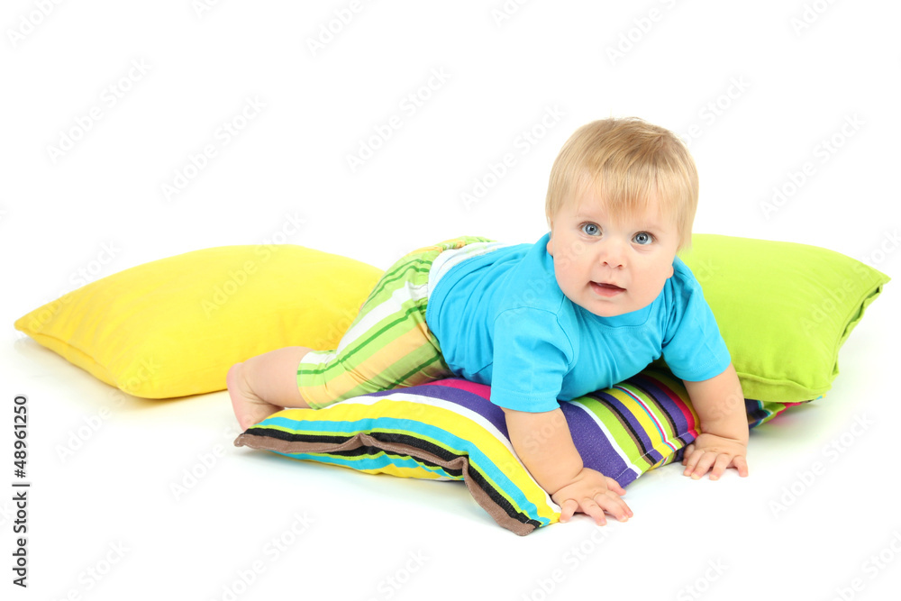 Little boy and color pillows, isolated on white Little boy and color pillows, isolated on white
