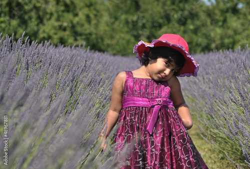 A Little Girl Playing in Lavender Garden