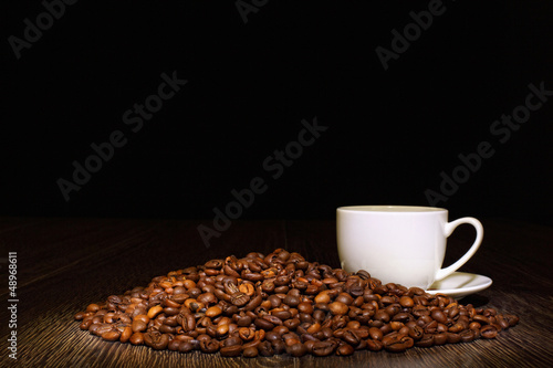 Coffee beans and white cup