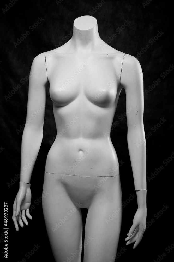 Fototapeta premium Old female fashion mannequin on a black background