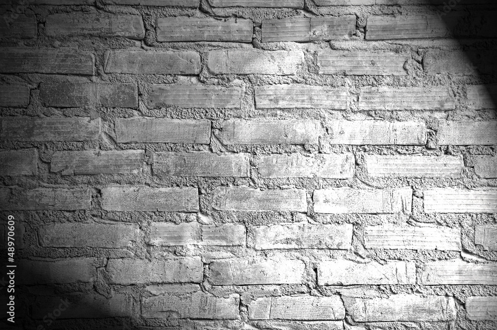Spotlight on the brick wall