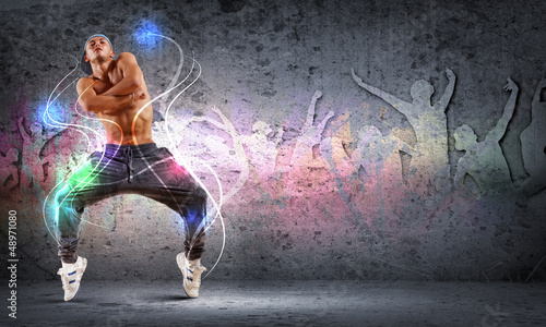 Vászonkép young man dancing hip hop with color lines