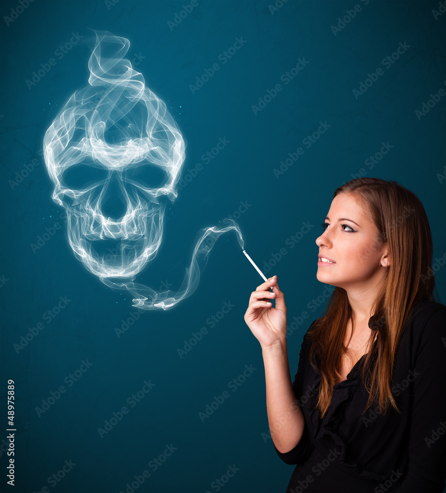 Obraz premium Young woman smoking dangerous cigarette with toxic skull smoke