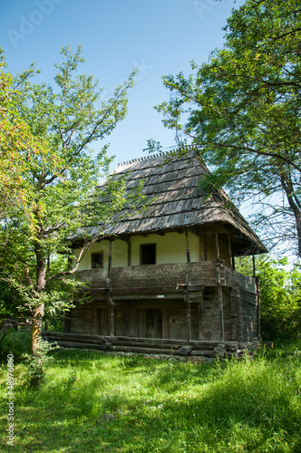 Beautiful wooden homestead in rural Romania © SilviuFlorin