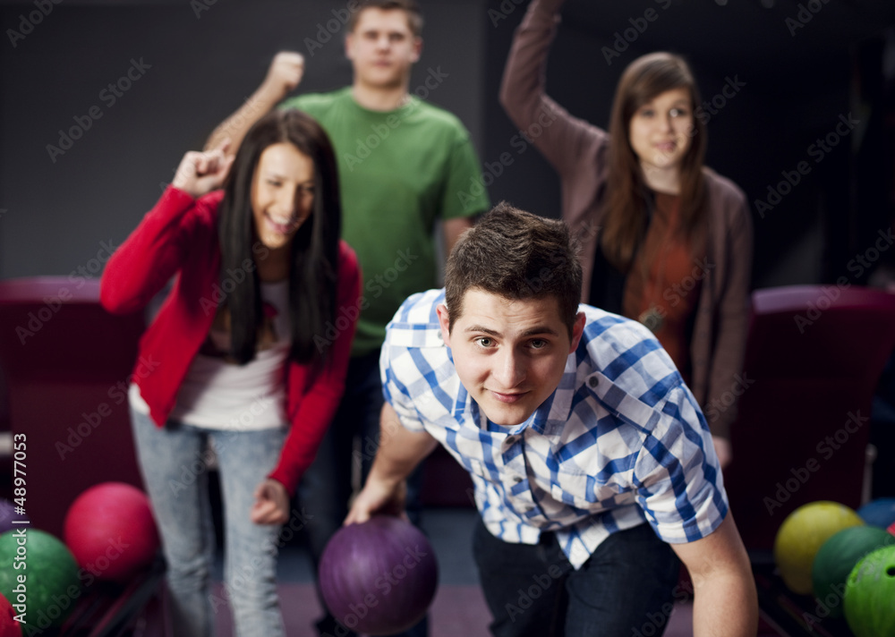 Friends bowling together Friends bowling together