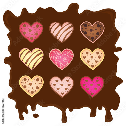 set of the sweetmeats in form heart on chocolate background