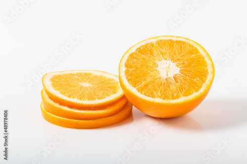 Slices of orange tangerine over white