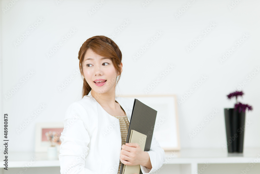 Beautiful young businesswoman working in office Beautiful young businesswoman working in office