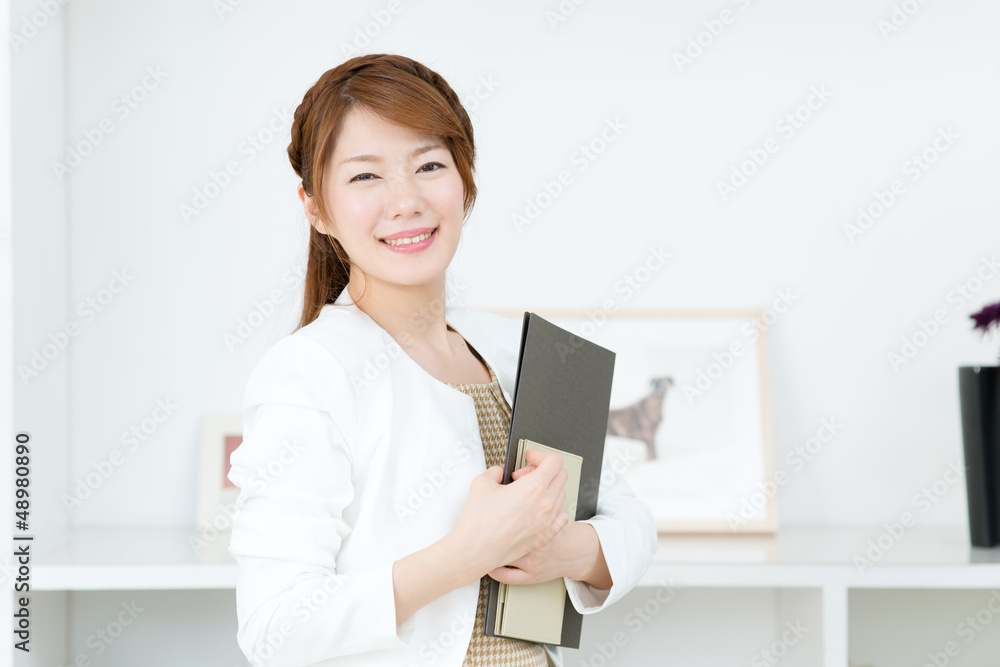 Beautiful young businesswoman working in office Beautiful young businesswoman working in office