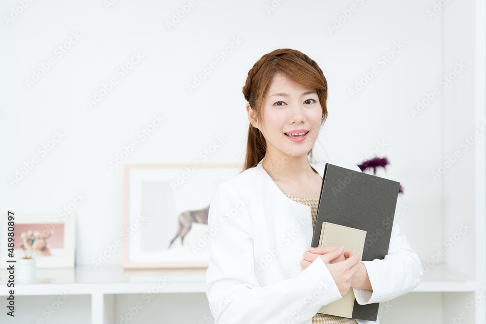 Beautiful young businesswoman working in office Beautiful young businesswoman working in office