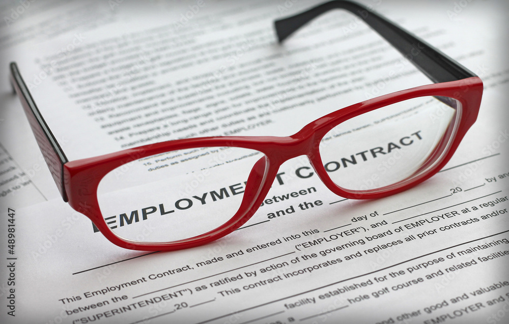 employment contract and female red glasses, close-up employment contract and female red glasses, close-up