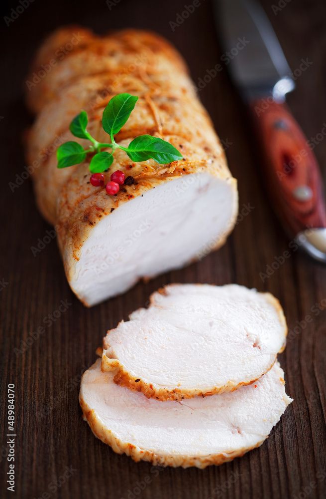 Baked chicken breast (Pastrami) with spices, selective focus