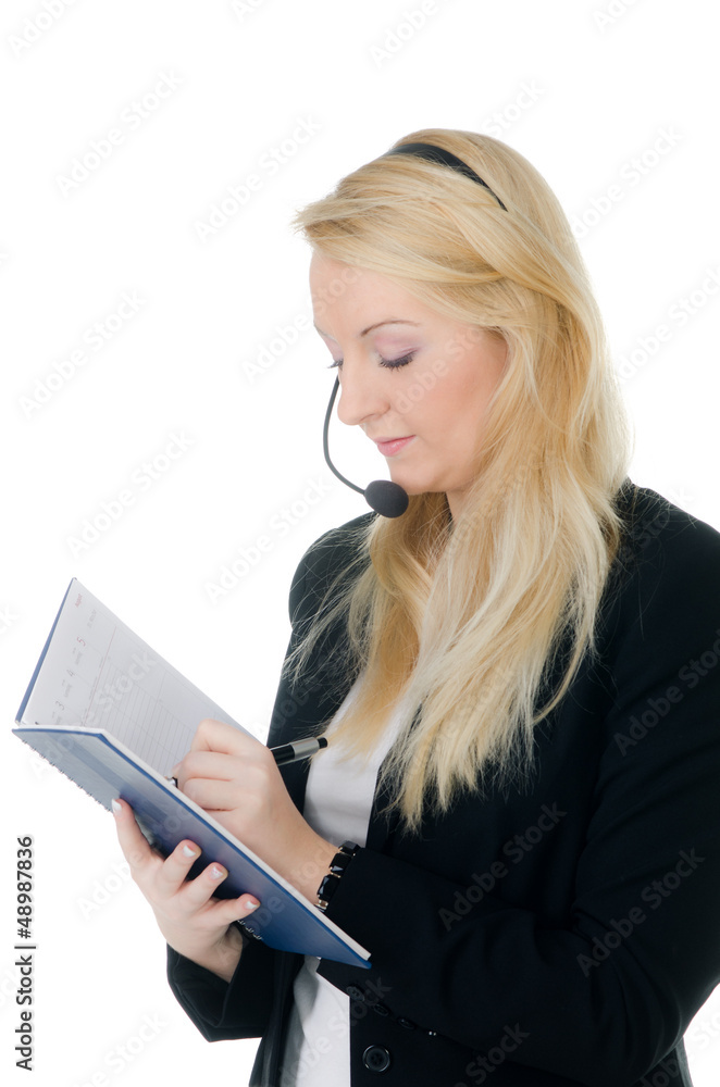 callcenter-mitarbeiterin notiert etwas callcenter-mitarbeiterin notiert etwas