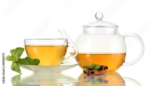 Cup of tea with mint and cinnamon isolated on white