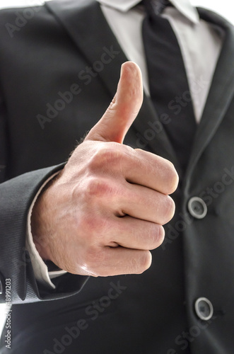 Business man showing a thumbs up sign