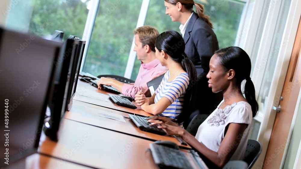 IT College Students Working with Tutor IT College Students Working with Tutor