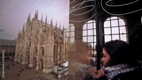 Tourist watching Duomo of Milan photo