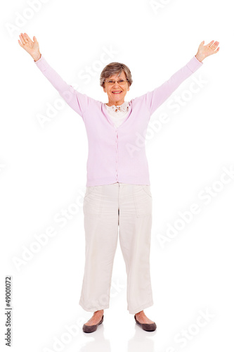 senior woman arms up isolated on white background
