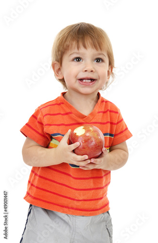 cute little boy eating appl...