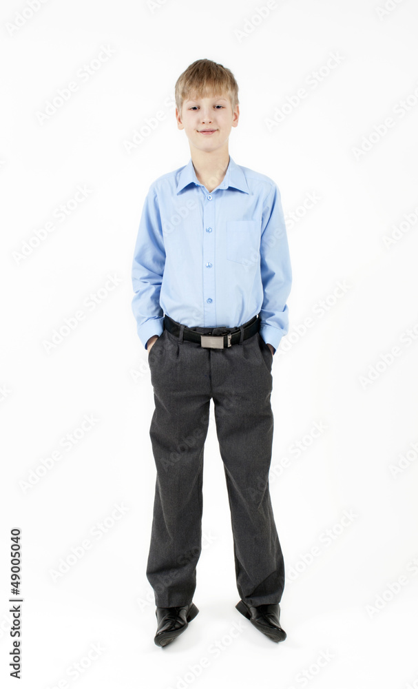 Boy on white background in a shirt and trousers Boy on white background in a shirt and trousers
