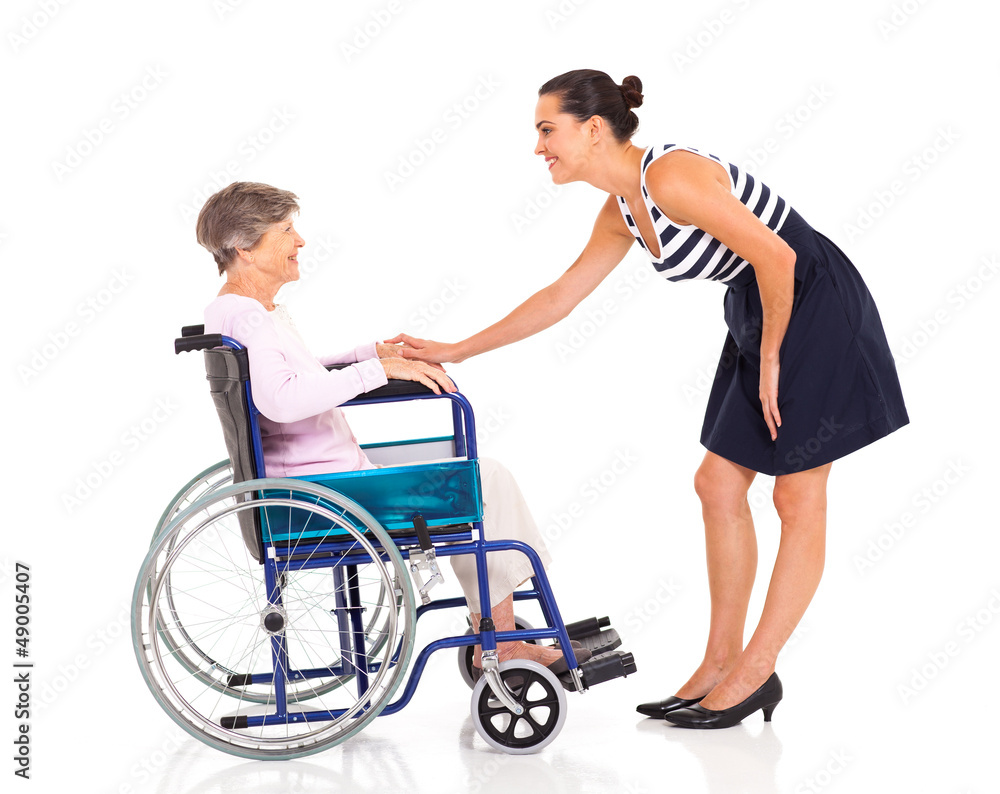 caring adult daughter talking to senior mother isolated on white caring adult daughter talking to senior mother isolated on white