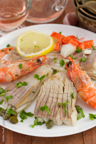 boiled fish with seafood ans lemon