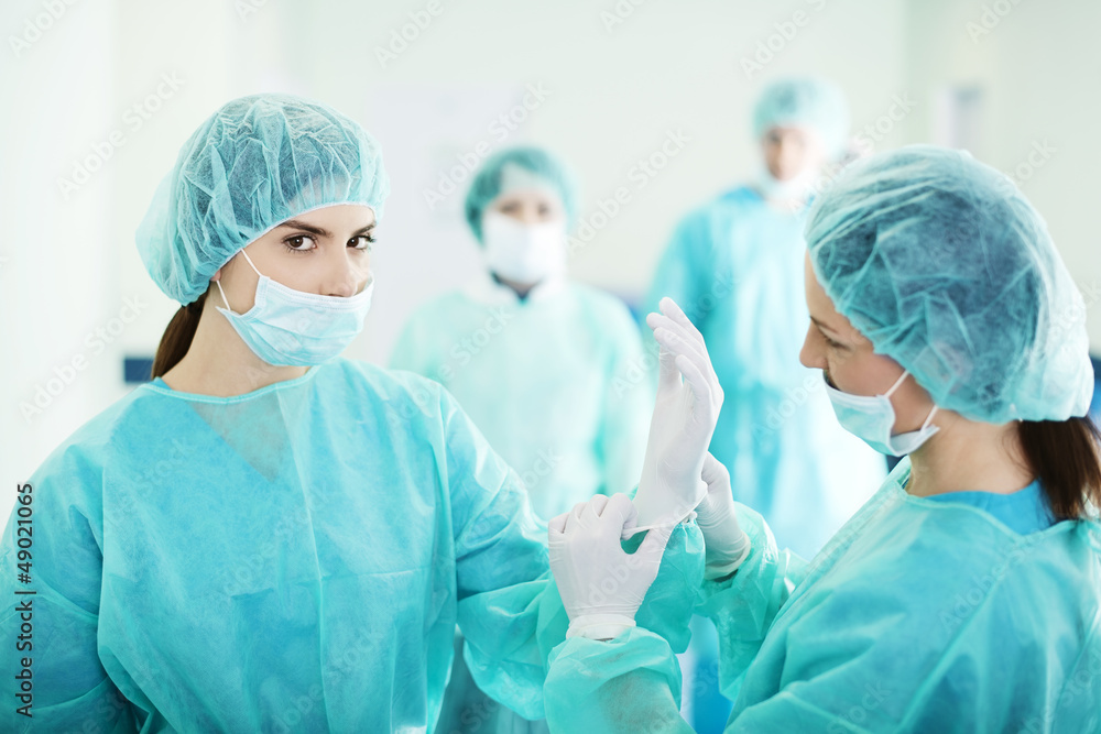 Doctors preparing for surgery Doctors preparing for surgery