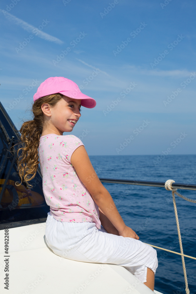 child happy girl sailing happy boat with cap Stock Photo | Adobe Stock