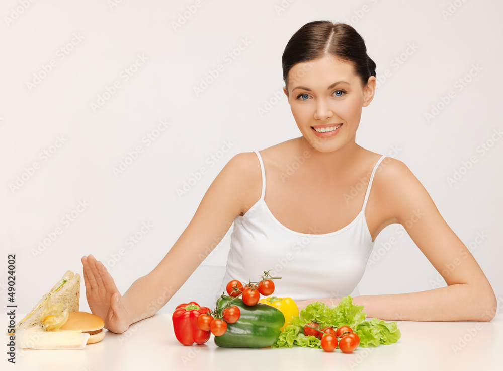 woman with hamburger and vegetables woman with hamburger and vegetables