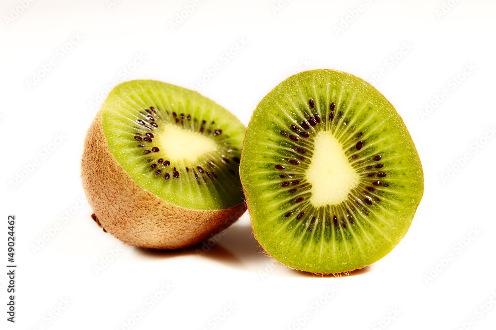 Fototapeta premium Halved Kiwi Fruit on white backdrop